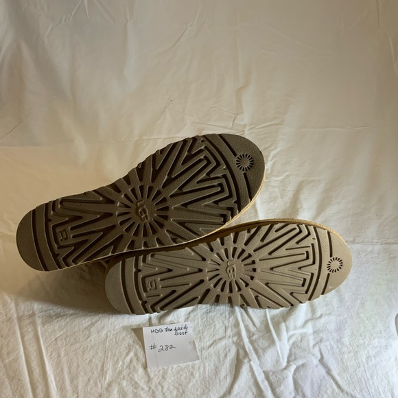 UGG - Tan Perforated suede boots.  Size 9.  Slight mark on heel of right shoe.